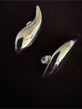 Vintage Monet Sleek Silver Sculptural Clip-On Earrings. Very shiny Silver Tone